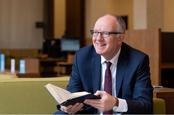 RAI Logo richard ovenden holding book