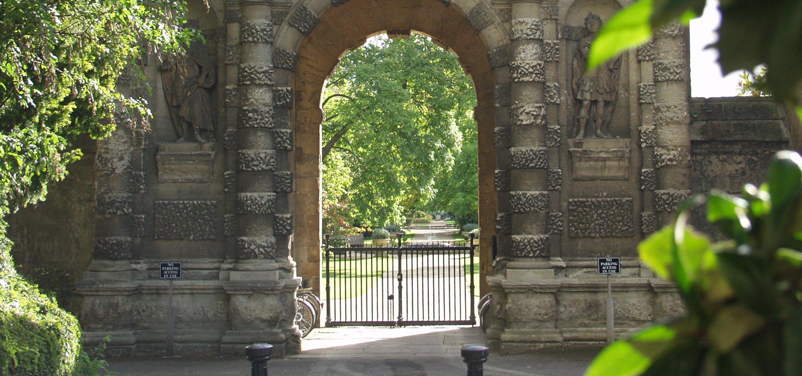 Stone archway and gate leading into gardens